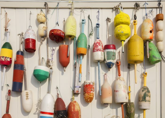 lobster buoys on the wall of the barn